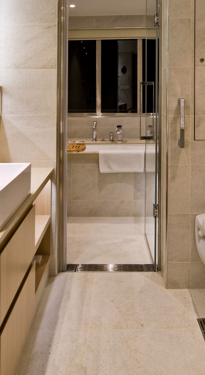 modern bathroom with dual sinks and toilet