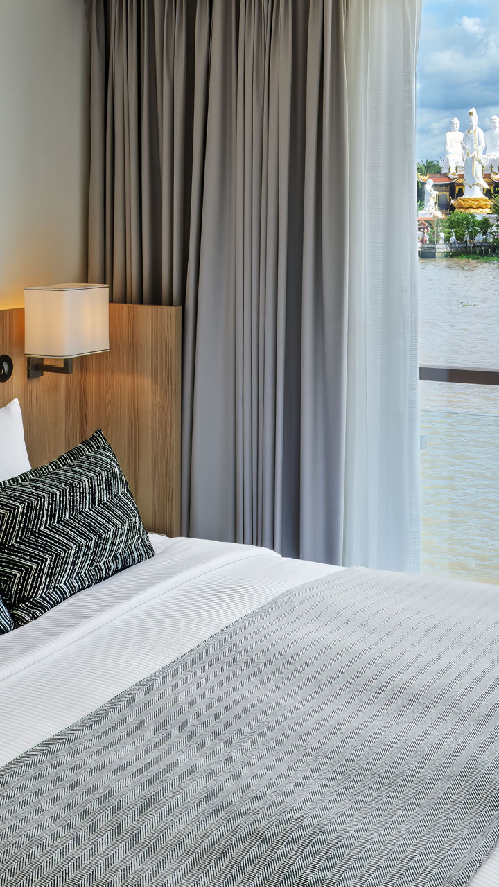 Modern hotel room with river view and large window