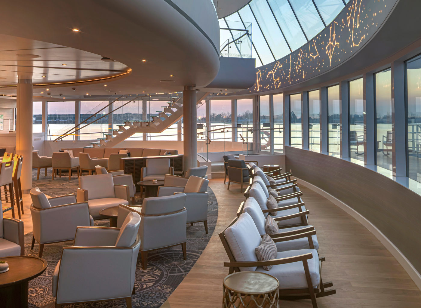 Modern airport lounge with curved glass windows