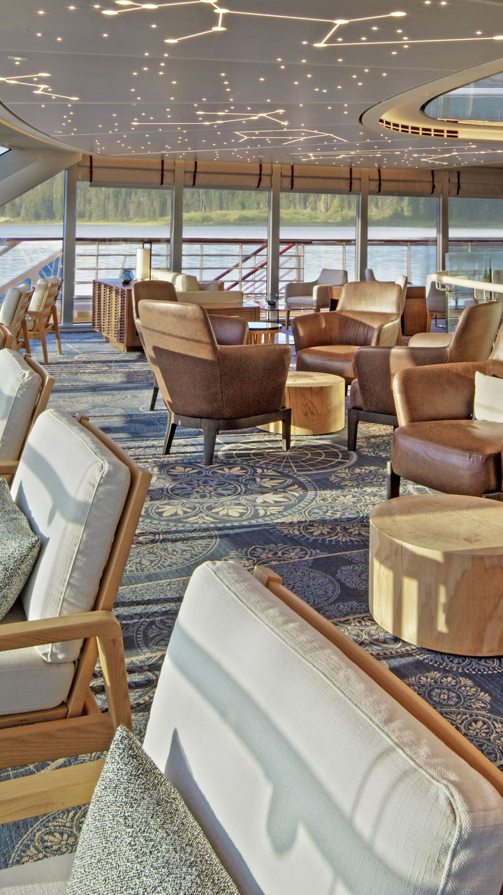 Elegant lounge with panoramic windows and starry ceiling
