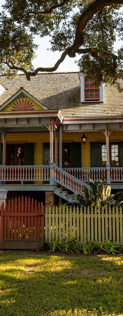 Historic Southern plantation house with vibrant colors