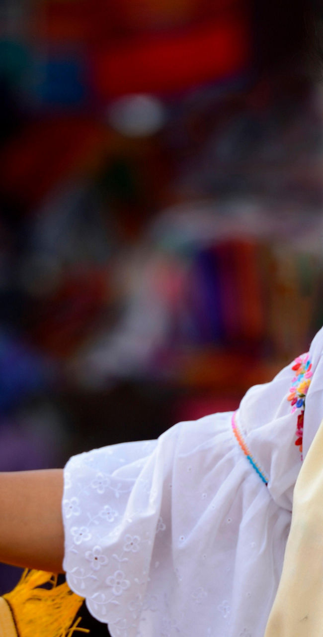 Traditional textiles displayed at outdoor market