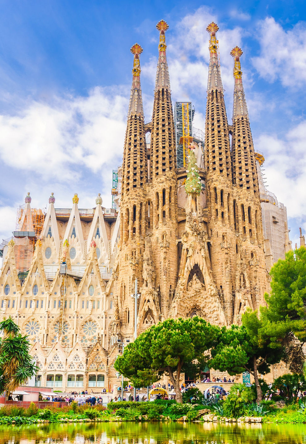 Sagrada Família basilica reflected in city pond