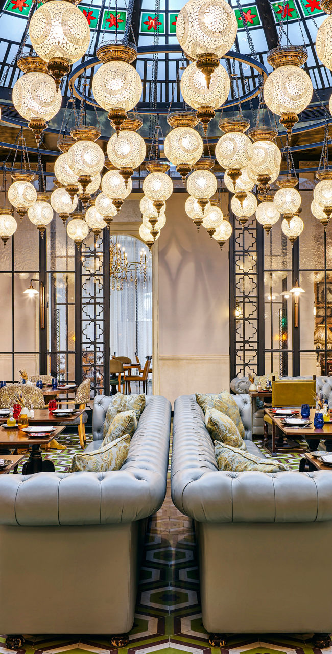 Elegant restaurant with ornate glass ceiling