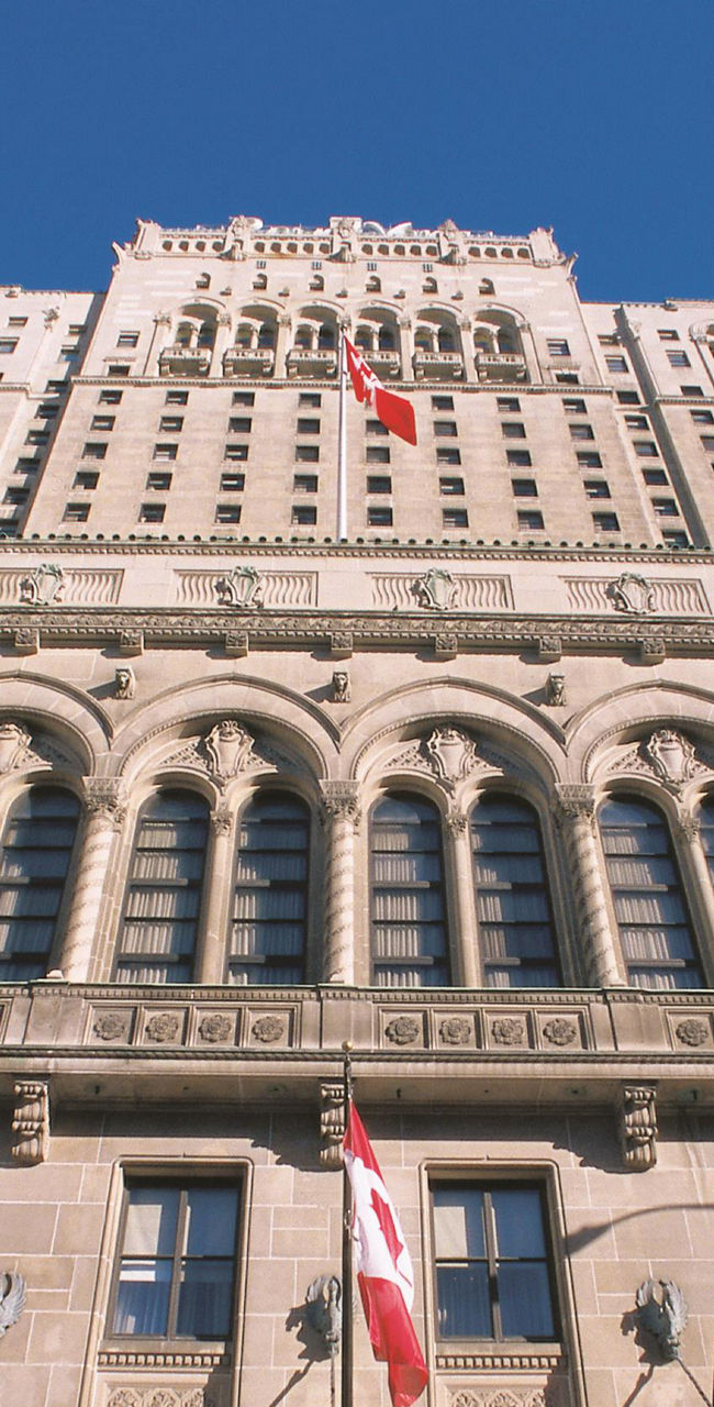 Historic building with international flags displayed