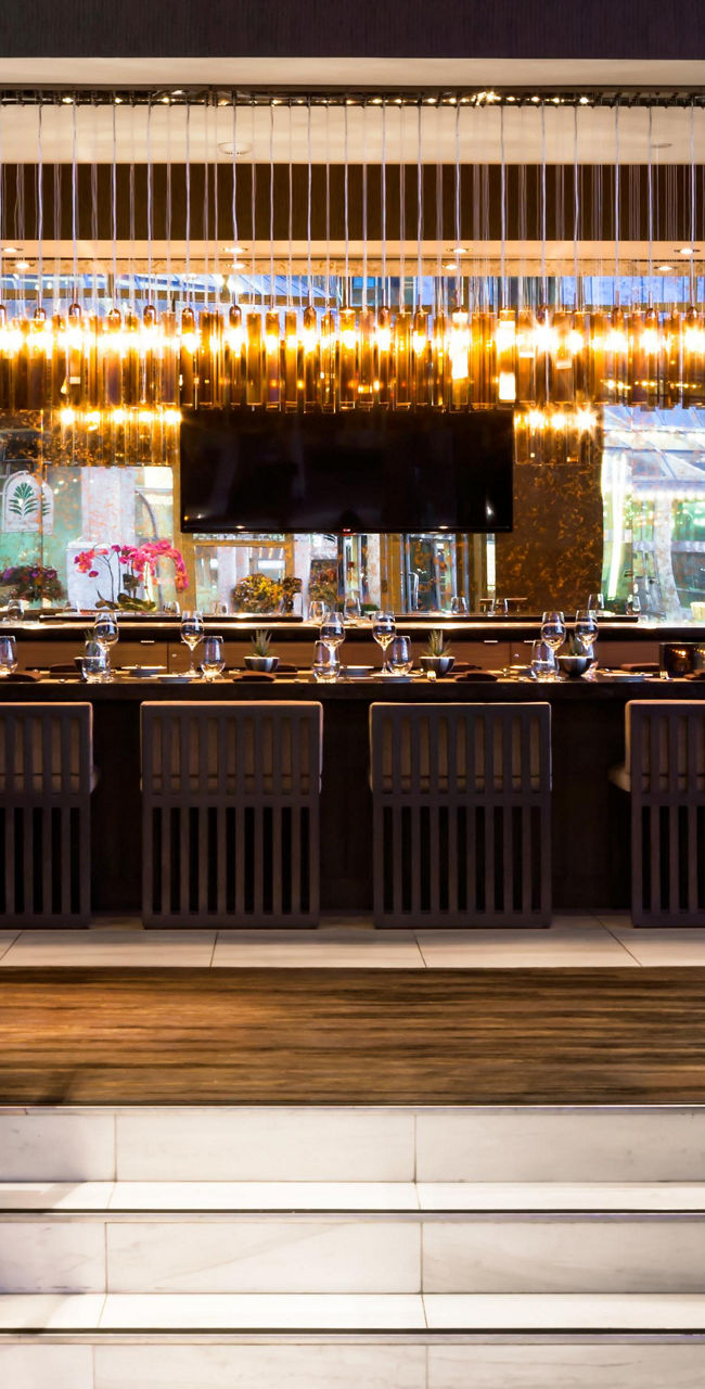Modern restaurant interior with wine display