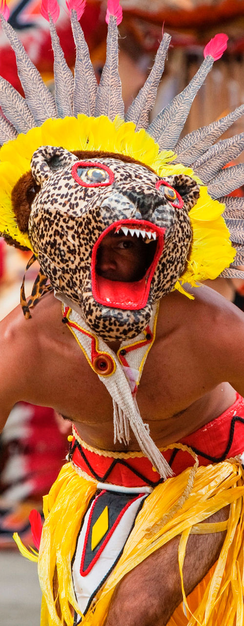 Traditional dancers in vibrant festival costumes