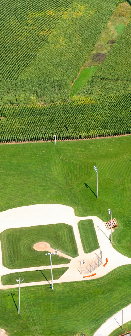 Aerial view of rural baseball field and farm