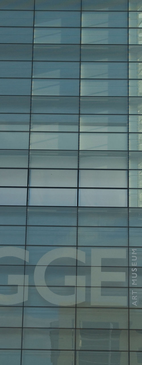 Modern glass building with art display