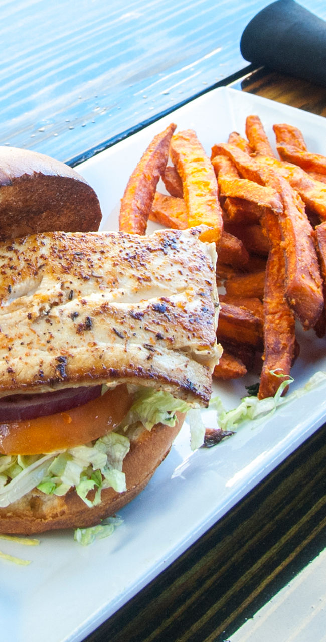 Grilled fish sandwich with sweet potato fries