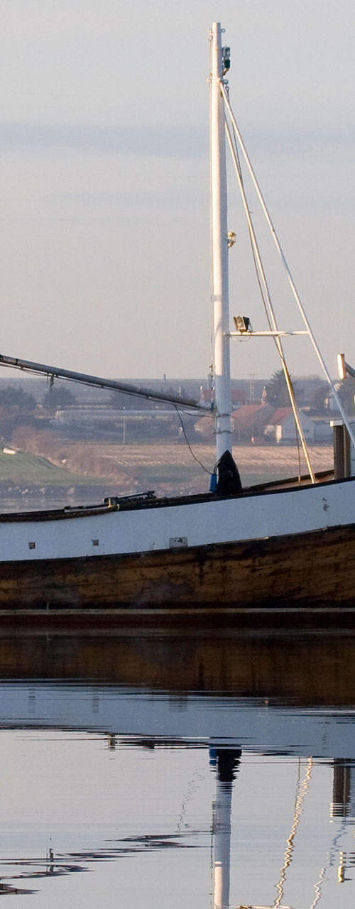 Wooden fishing boat on calm waters
