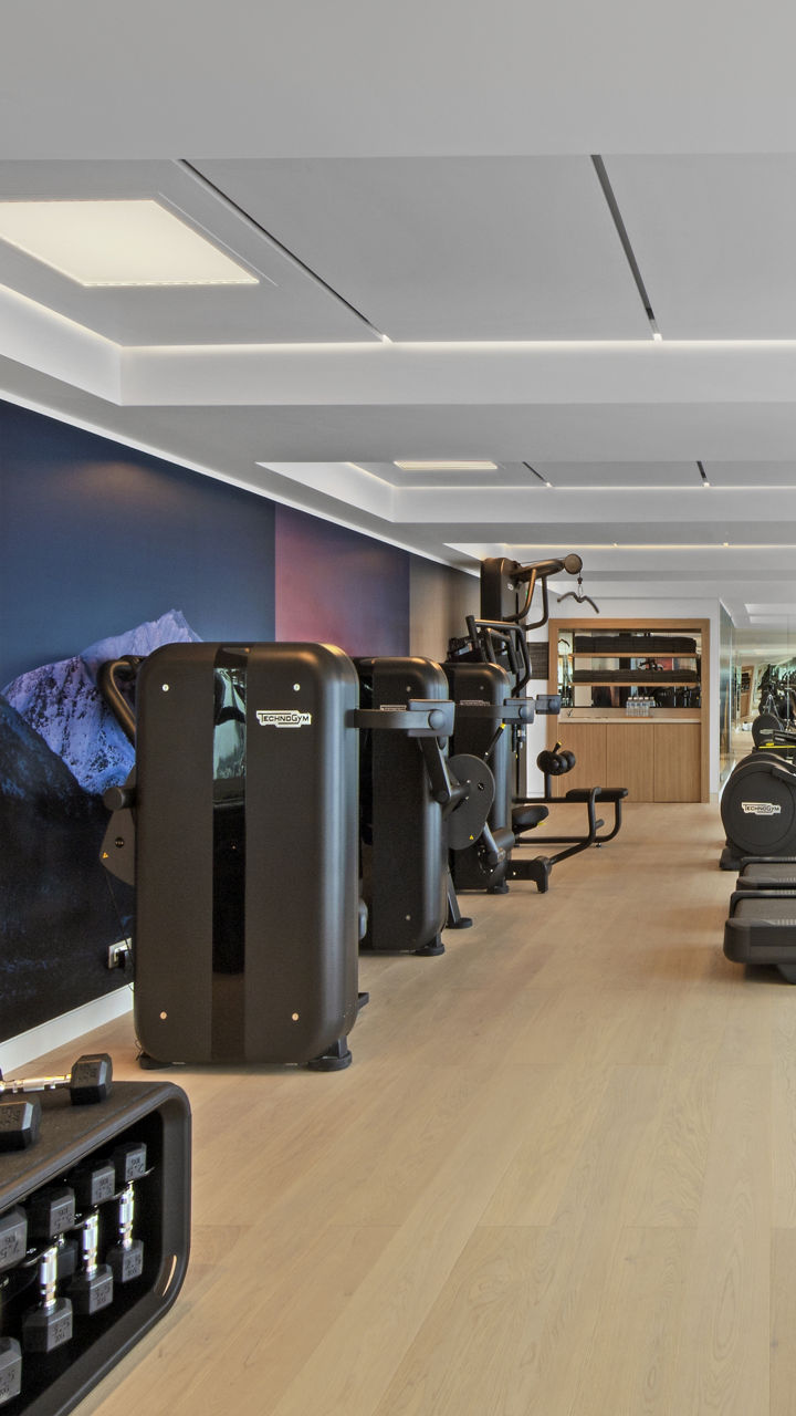 Modern gym with ocean view and equipment
