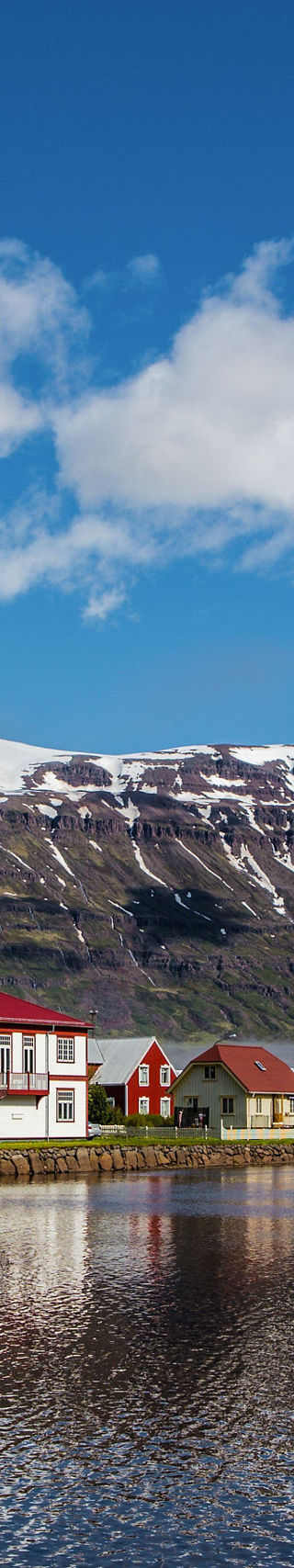 Scenic village with snow-capped mountains