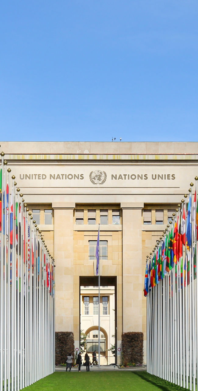 United Nations building with flag display