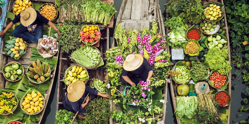 Floating market with vibrant produce and flowers