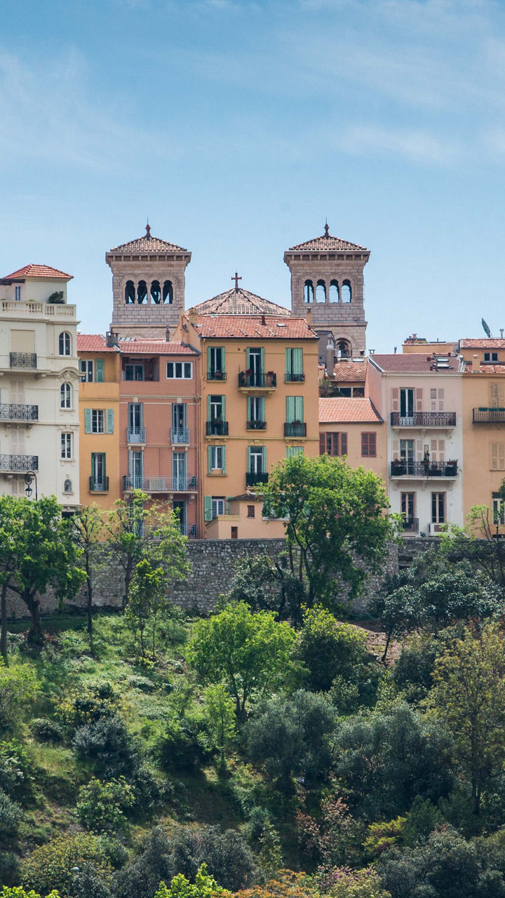 Colorful hillside buildings under blue sky