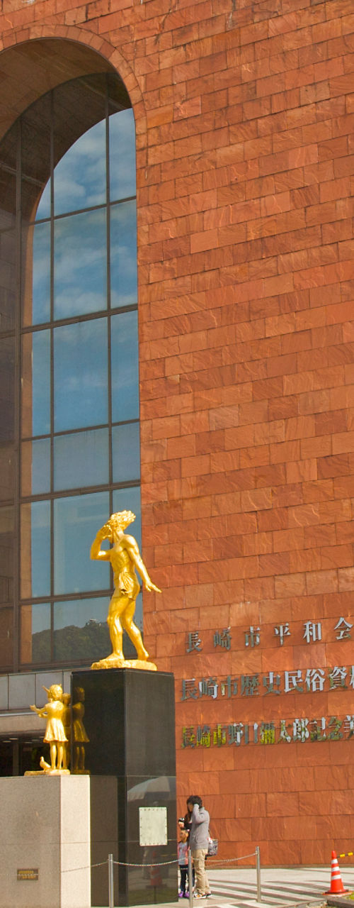 Modern Red Brick Museum Building with Statue Exterior