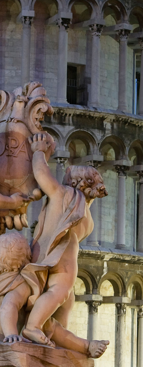 Leaning Tower of Pisa with statue foreground