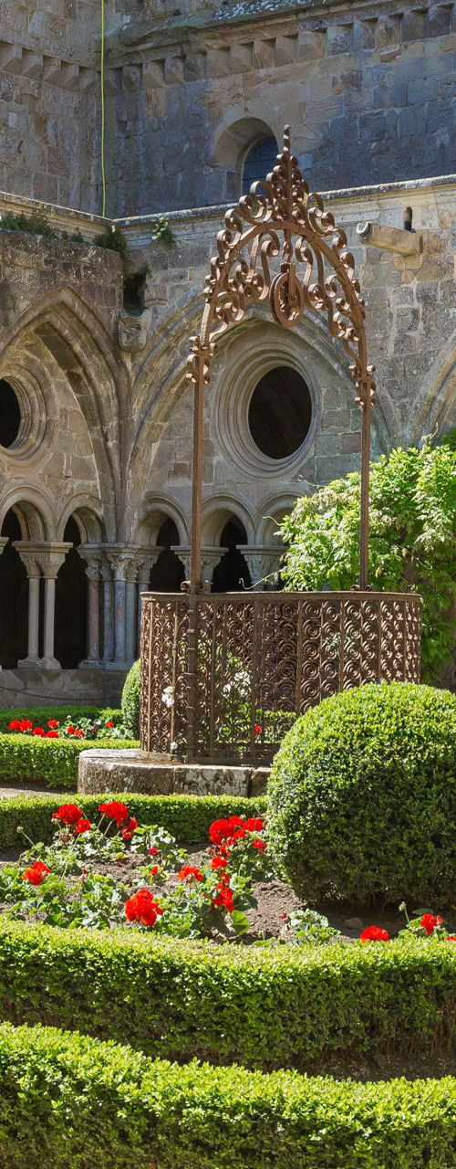 Historic monastery courtyard with manicured garden