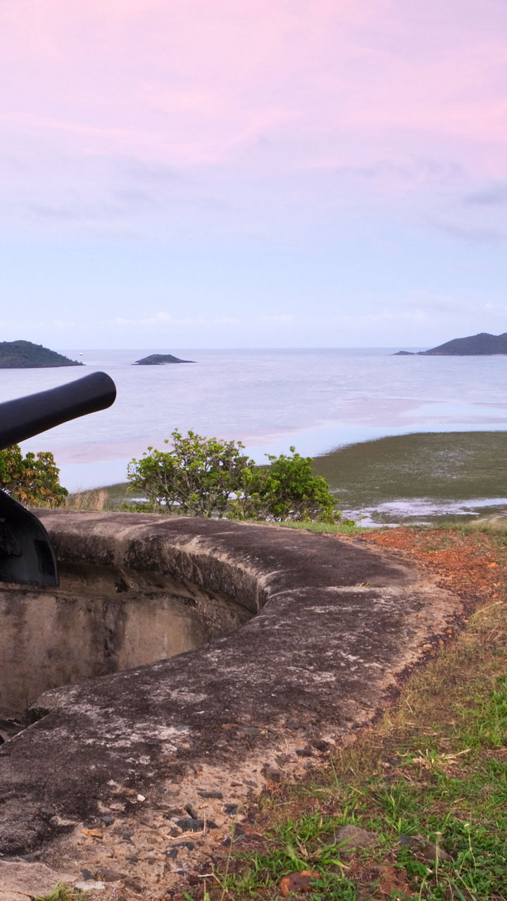 Historic cannon overlooking scenic coastline