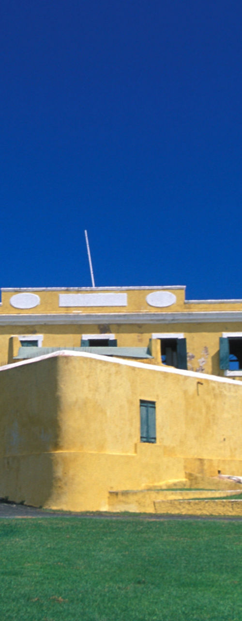 Historic yellow fort under clear blue sky