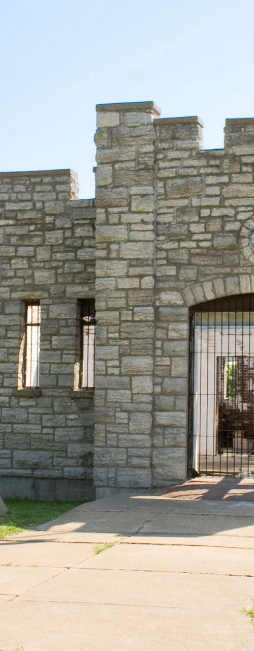 Stone castle with American flag in park