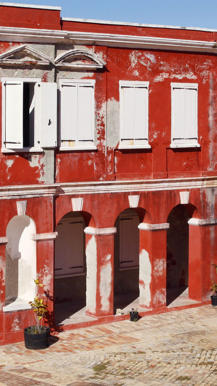 Historic red building with '1760' facade