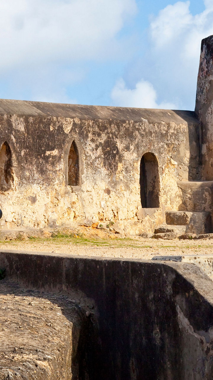 Historic stone fort with old cannon