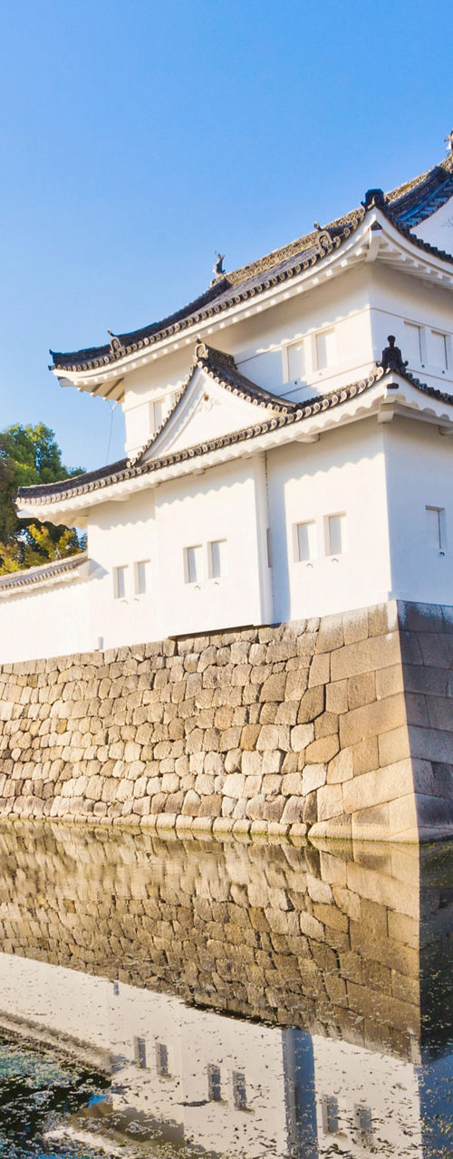 Traditional Japanese castle with water reflection