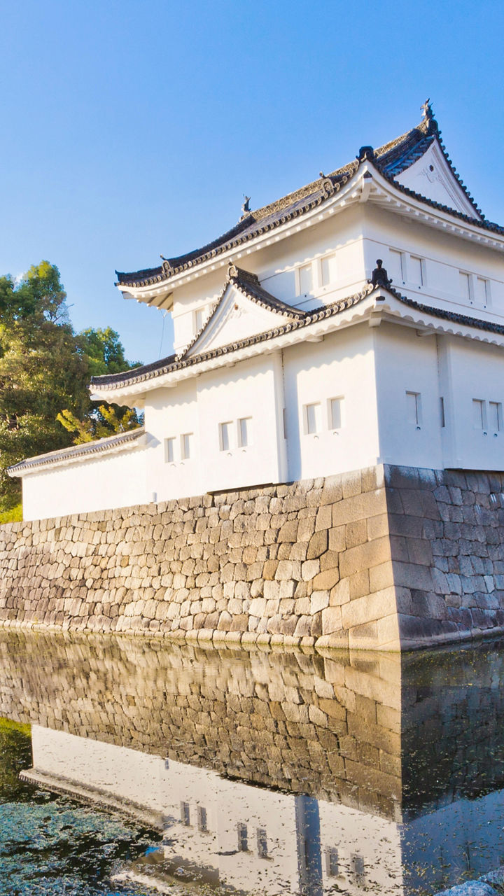 Traditional Japanese castle with water reflection