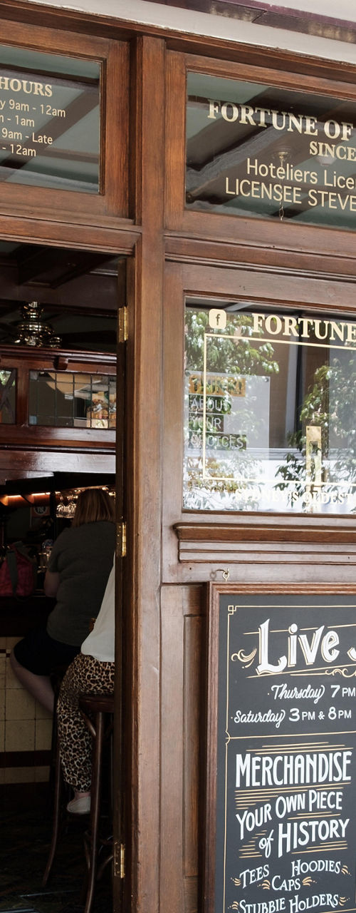 Historic bistro entrance with live music signage