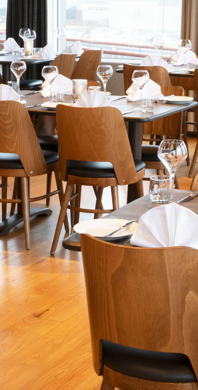 Elegant restaurant dining area with table settings