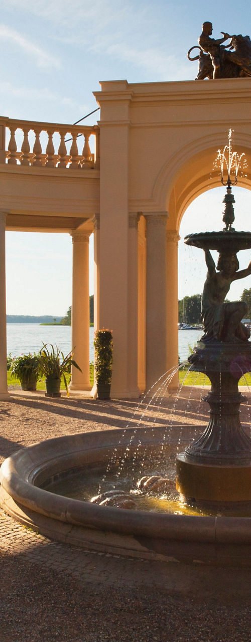 Elegant courtyard with fountain at sunset