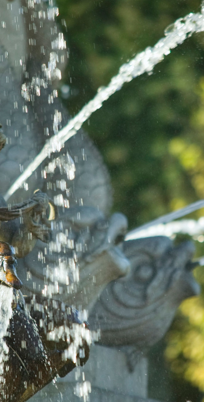 Ornate fountain with water streams outdoors