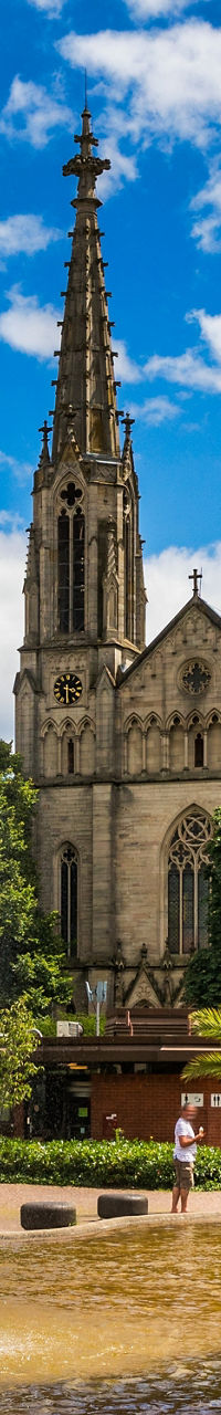 Historic church with fountain in urban park