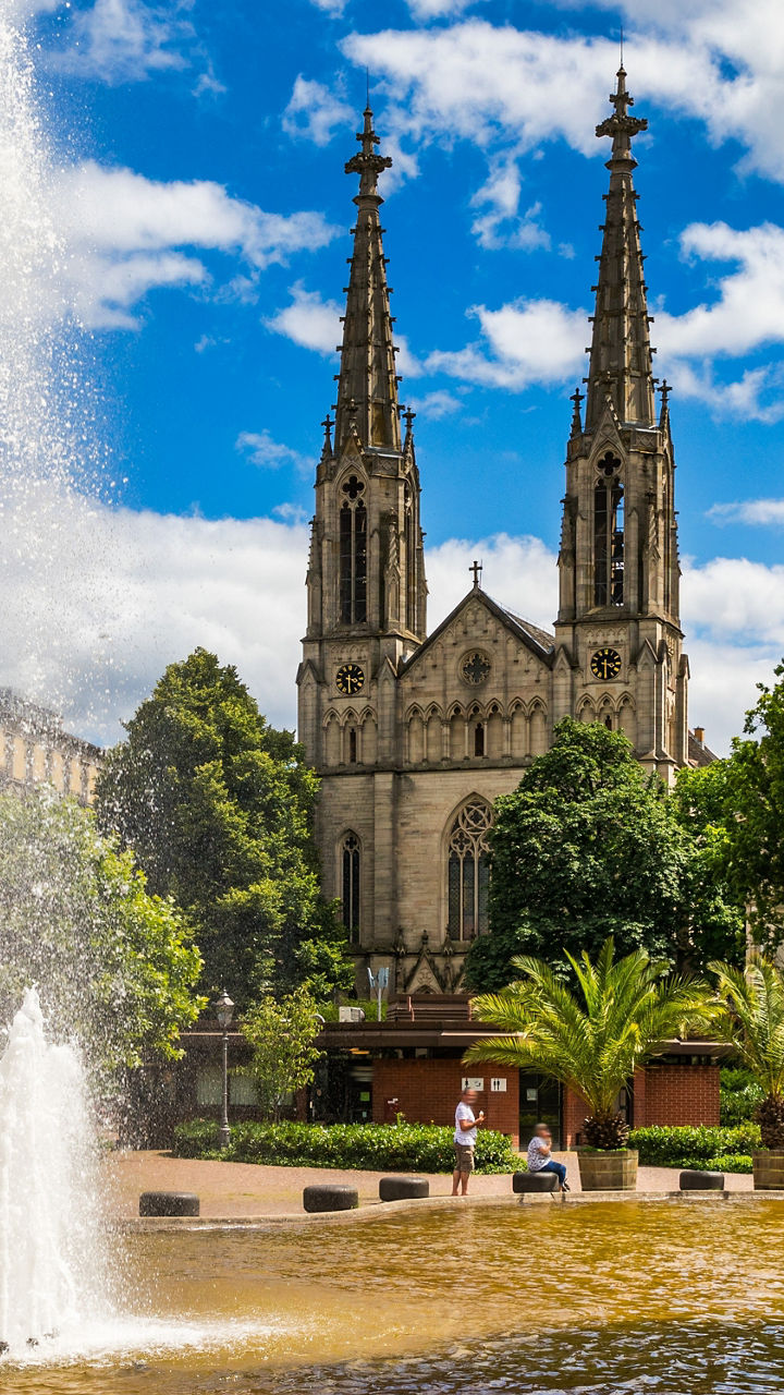 Historic church with fountain in urban park