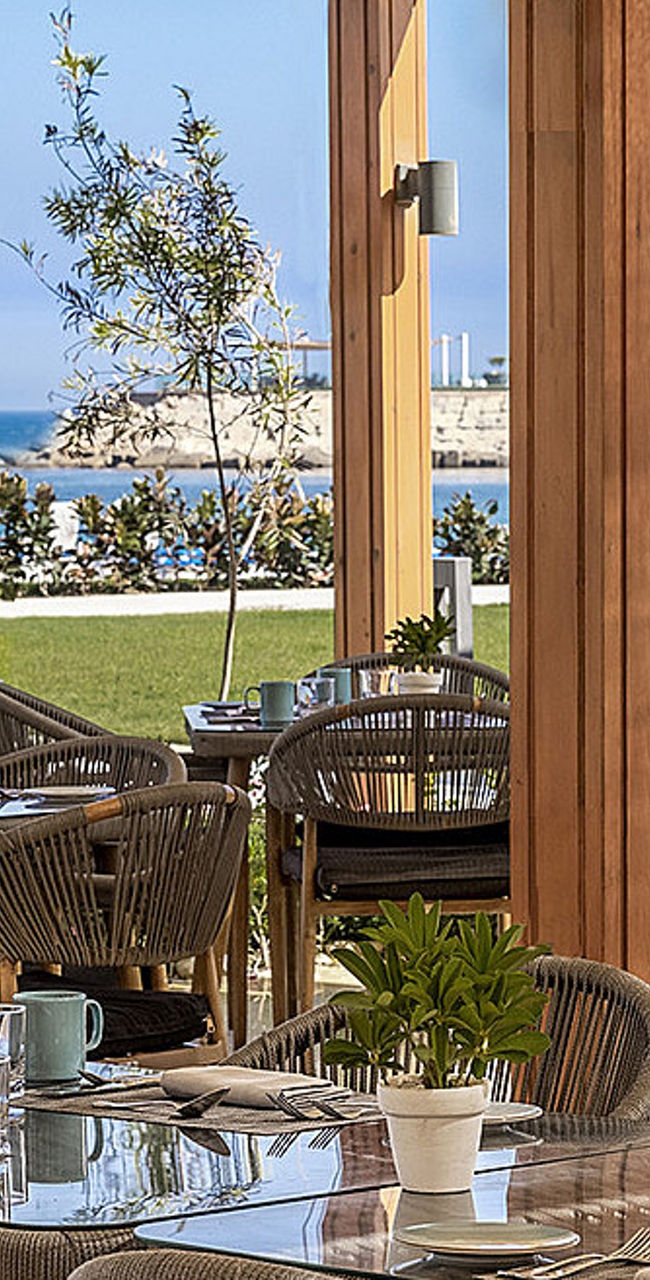 Outdoor dining area with ocean view