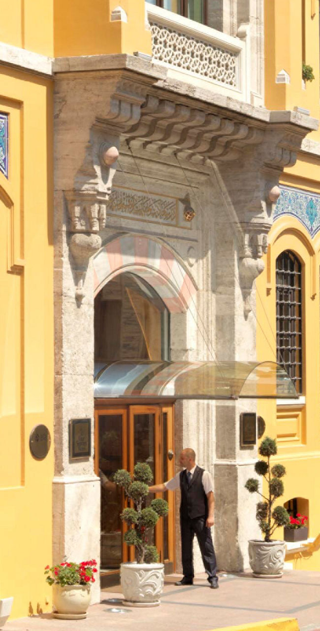 Elegant yellow building with arched windows