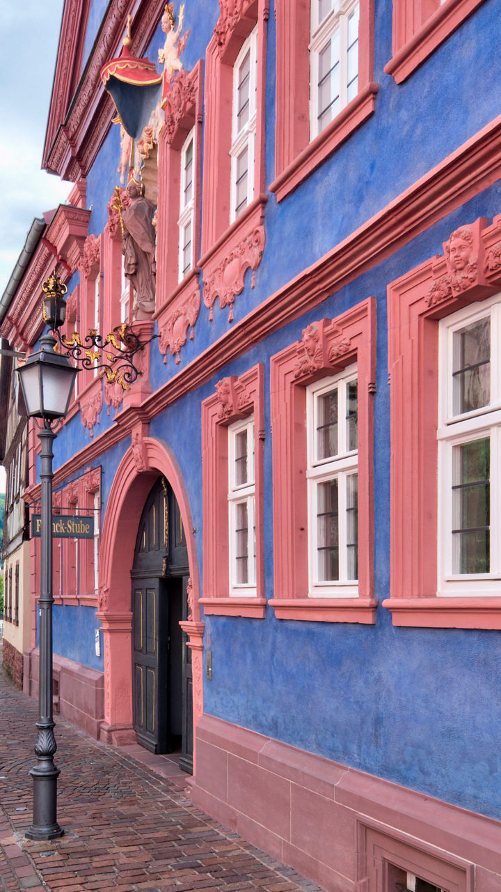 Colorful historic building on cobblestone street