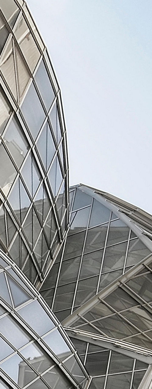 Modern glass architecture with urban backdrop