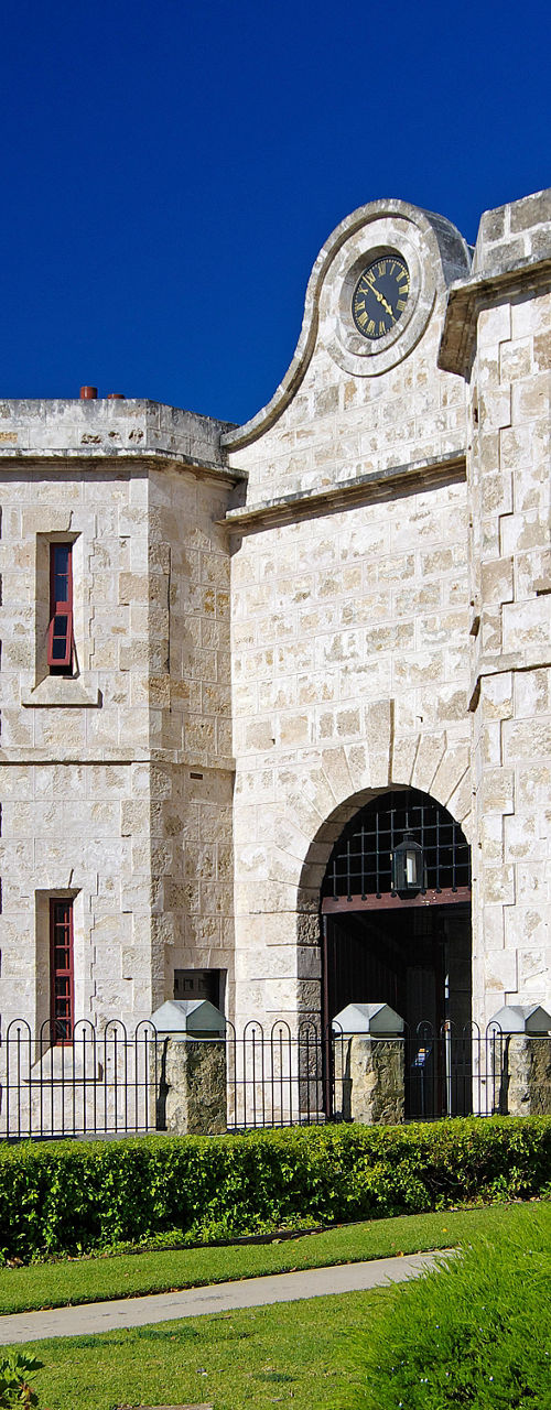 Historic stone building with Australian flag