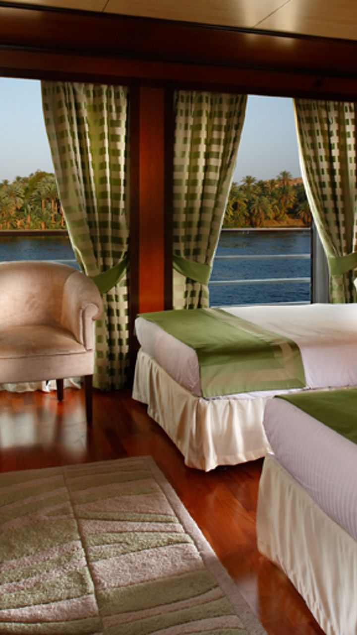 Luxury riverside hotel room with twin beds