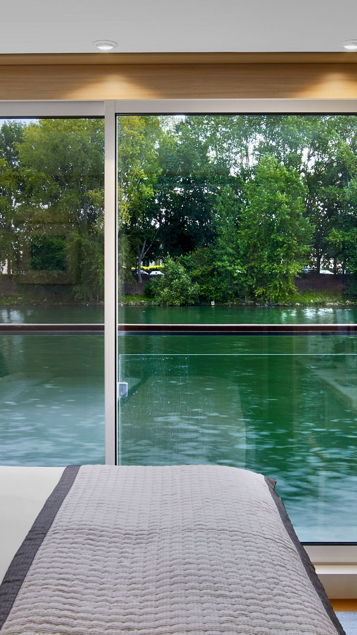 Modern riverfront hotel room with scenic view