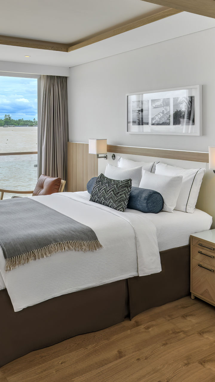 Modern hotel room with river view and workspace
