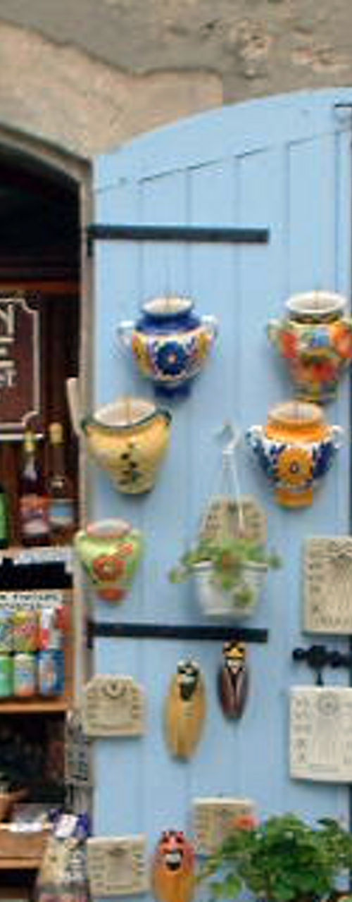 Rustic French shop with blue shutters