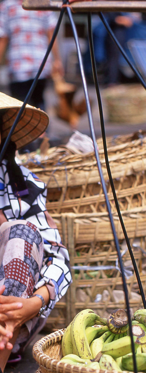 Street vendors with fresh produce baskets