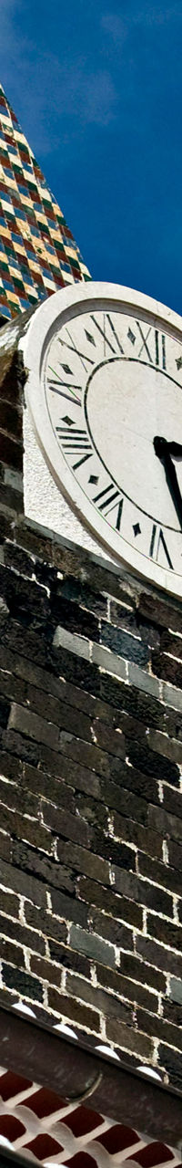 Historic clock tower against blue sky