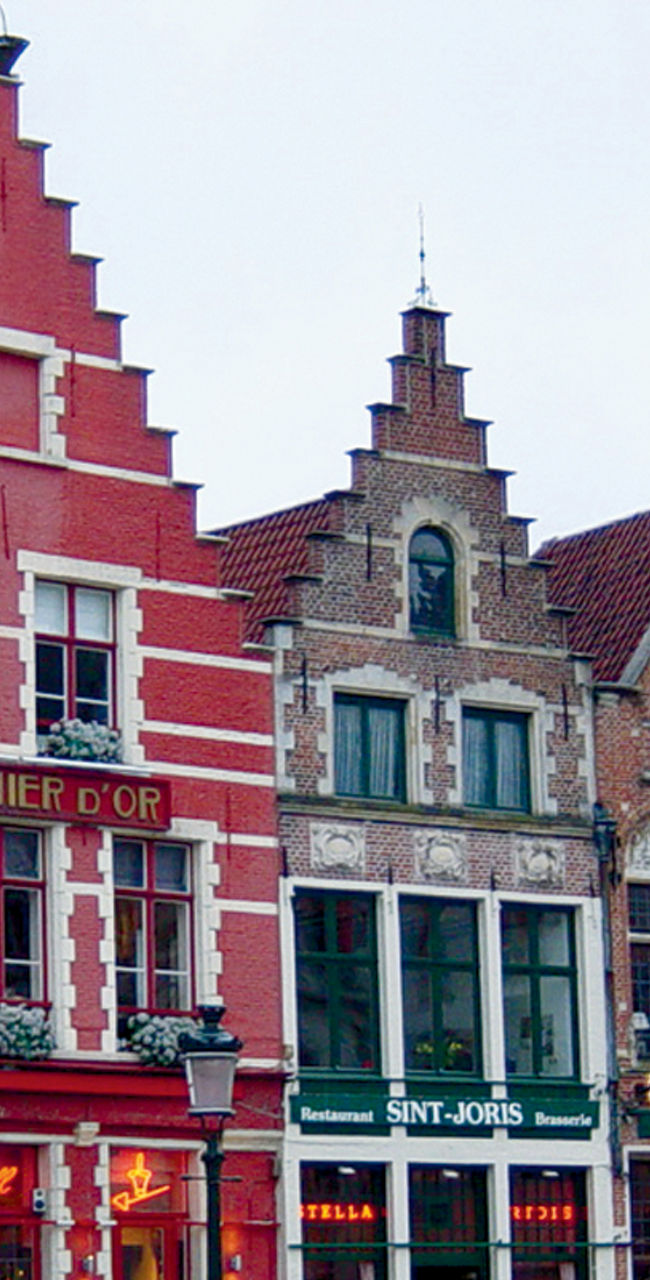 Colorful historic buildings in Bruges square