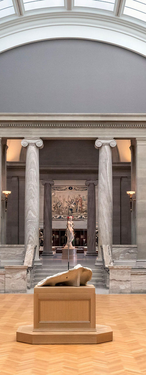 Art gallery interior with paintings and sculptures