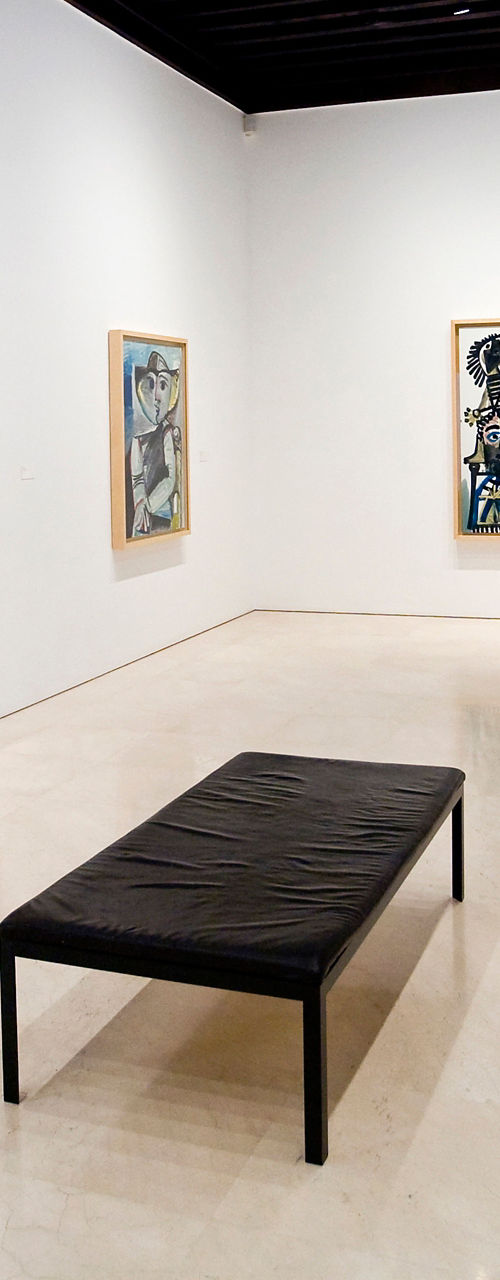Modern art gallery with framed paintings